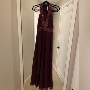 Floor length burgundy gown with sequins detail
